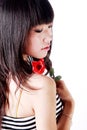 Asian girl holds a rose