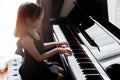 Asian girl kids practice play piano Royalty Free Stock Photo