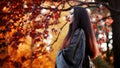 Asian girl in kimono on background of red maple Royalty Free Stock Photo