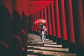 Asian girl in kimono and umbrella in Japanese theme park Hinoki Land in Chai Prakan District, Chiang Mai, Thailand Royalty Free Stock Photo