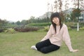 Asian girl on lawn Royalty Free Stock Photo