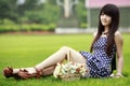 Asian girl on the lawn Royalty Free Stock Photo