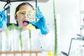 Asian girl leaning and education science lab research Aloe Vera with microscope for Natural