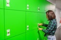 Girl leaves valuables in the storage system in the shopping center