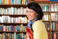 Asian girl at library holding a book Royalty Free Stock Photo