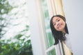 Asian girl look out the window Royalty Free Stock Photo