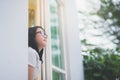 Asian girl look out the window Royalty Free Stock Photo