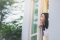 Asian girl look out the window Royalty Free Stock Photo