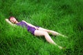 Asian girl lying on grass Royalty Free Stock Photo