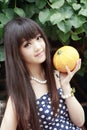 Asian girl with melon Royalty Free Stock Photo