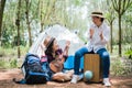 Asian girl and mother playing music in outdoors forest. People and lifestyles concept. Nature and Travel theme