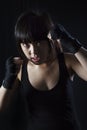 Asian girl Muay Thai fighter in defensive position