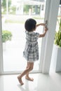 Asian girl opend door at home. Royalty Free Stock Photo