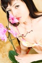 Asian girl with orchid Royalty Free Stock Photo