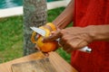 Asian girl peel mango, Indonesia, Bali