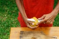 Asian girl peel mango, Indonesia, Bali