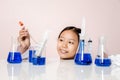 Asian girl playing as a scientist to experiment with laboratory equipment