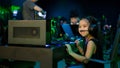 Asian girl playing computer games in internet cafe Royalty Free Stock Photo