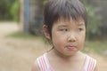 Asian girl playing on the playground and left eyes.