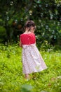 Asian girl playing with soap bubbles on nature background. Outdo Royalty Free Stock Photo