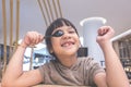 Asian girl playing with spoon on dinner table Royalty Free Stock Photo