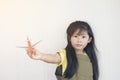 Asian girl playing toy airplane Royalty Free Stock Photo
