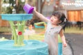 Asian girl playing water toys in playground, Cute child happy preschool little kid having funny while playing, Learning and Royalty Free Stock Photo