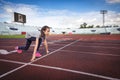 Asian girl prepare to run in the starting point at the racetrack, running and exercise for health