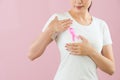 Asian girl put pink knot anti-breast cancer