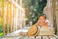 Asian girl reading book on the old bridge Royalty Free Stock Photo