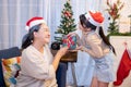 Asian girl received Christmas gift from her grandmom