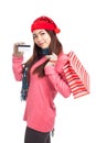 Asian girl with red christmas hat ,credit card and shopping bag Royalty Free Stock Photo