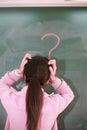 Asian girl with a red question mark Royalty Free Stock Photo