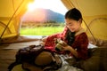 Asian girl relax inside tent Royalty Free Stock Photo