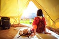 Asian girl relax inside tent Royalty Free Stock Photo