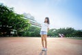 Asian girl on runway in school playground