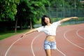 Asian girl on runway in school playground