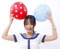 A naive girl and two balloon Royalty Free Stock Photo