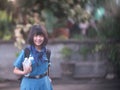 Asian Girl Scouts carry water bottles and face masks to prepare for school and camp Royalty Free Stock Photo