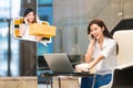 Asian girl shop online using phone call with female small business owner delivering parcel box. Internet shopping lifestyle