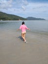 asian girl in shorts by the beach on sunny day