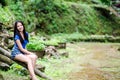 Asian girl sit down path in Bamboo forest Royalty Free Stock Photo