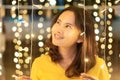 Asian girl smileing with bokeh light in christmas day, selective focus Royalty Free Stock Photo