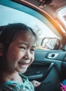 Asian girl smiling with perfect smile while sitting in the car. Royalty Free Stock Photo