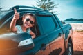 Asian girl smiling with perfect smile while sitting in the car. Royalty Free Stock Photo