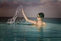 Asian girl snorkeling in crystal clear water Royalty Free Stock Photo