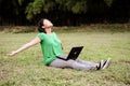 Asian girl stretches in the park Royalty Free Stock Photo