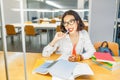 Asian girl student doing homework in library Royalty Free Stock Photo