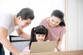 Asian girl student online learning class study using laptop and parent take care