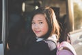 Asian girl in student uniform going to school by car Royalty Free Stock Photo